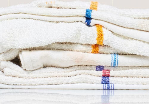 How are kitchen towels cleaned?
